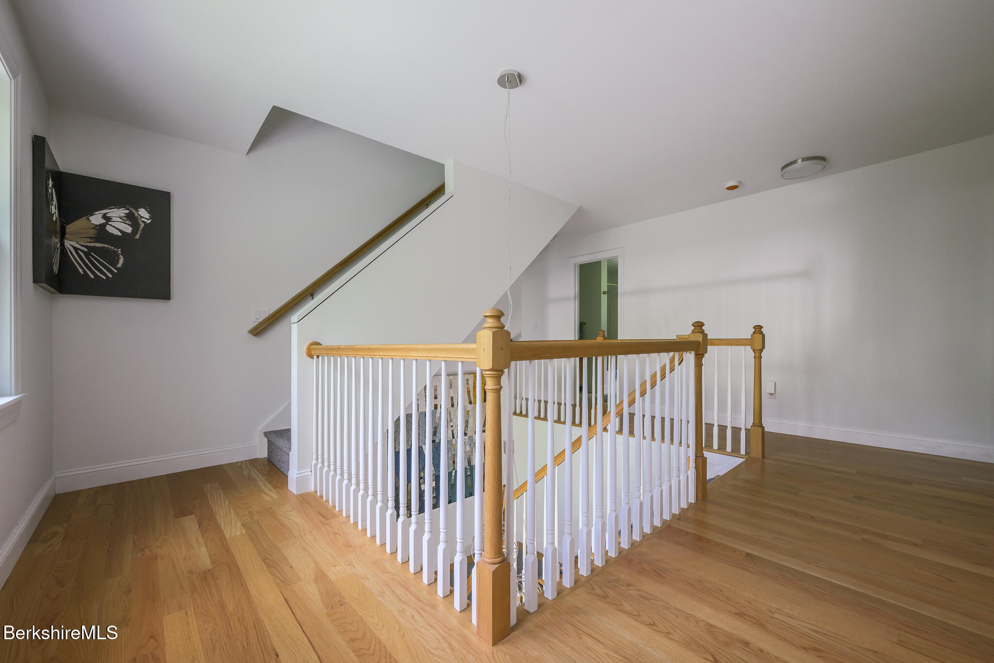 50 Old Village Road Alford, MA 01230 - Photo 42 of 66 a view of a hallway with wooden floor and door