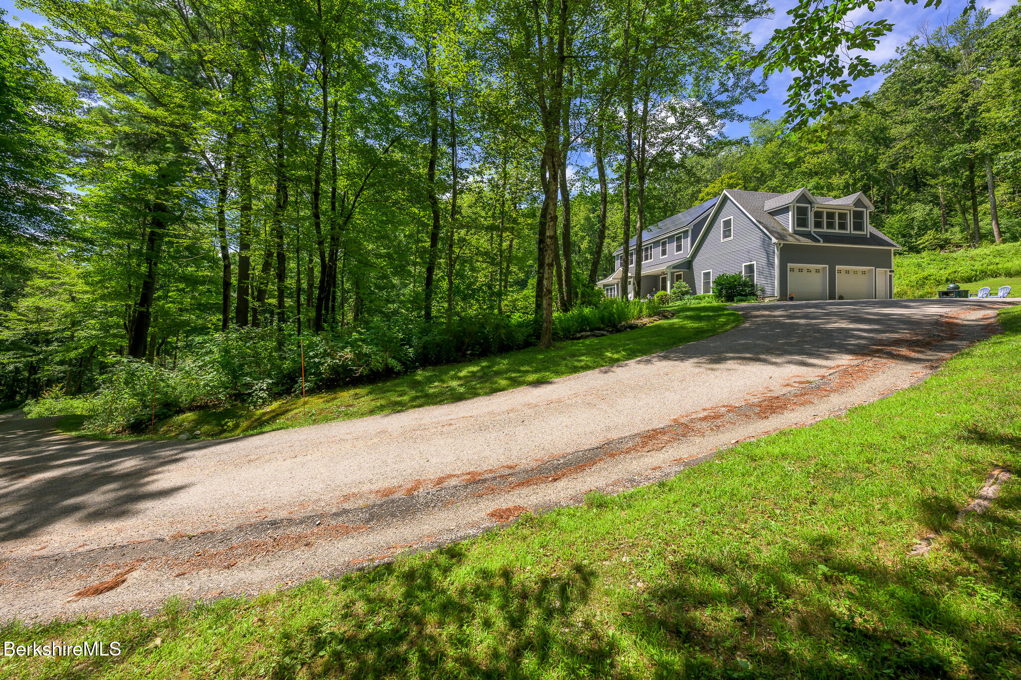 50 Old Village Road Alford, MA 01230 - Photo 5 of 66 a front view of a house with a garden and trees