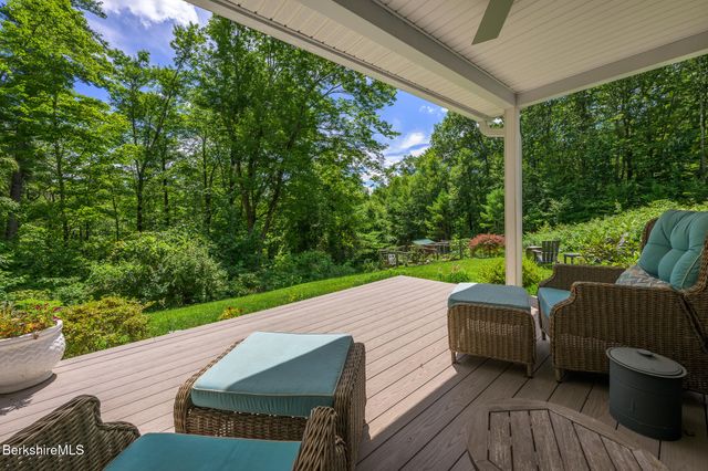 a view of house with backyard