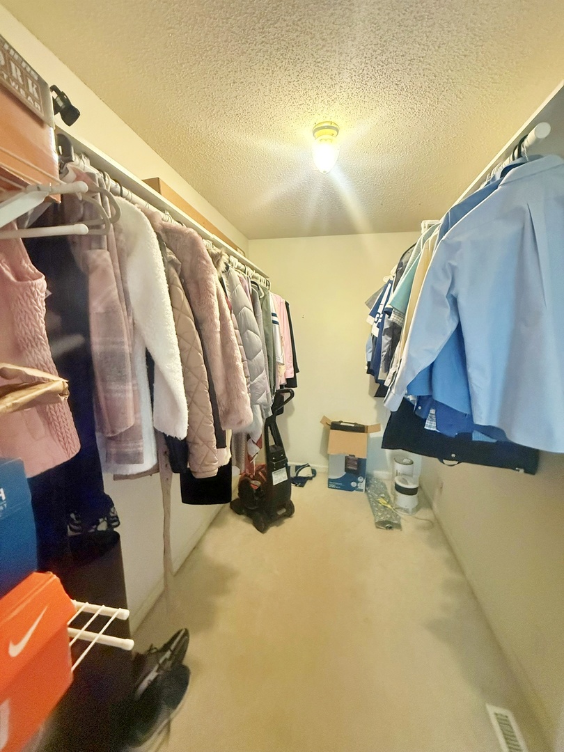 3675 Macedonia Road Metropolis, IL 62960 - Photo 47 of 50 a view of walk in closet with clothes and shoes