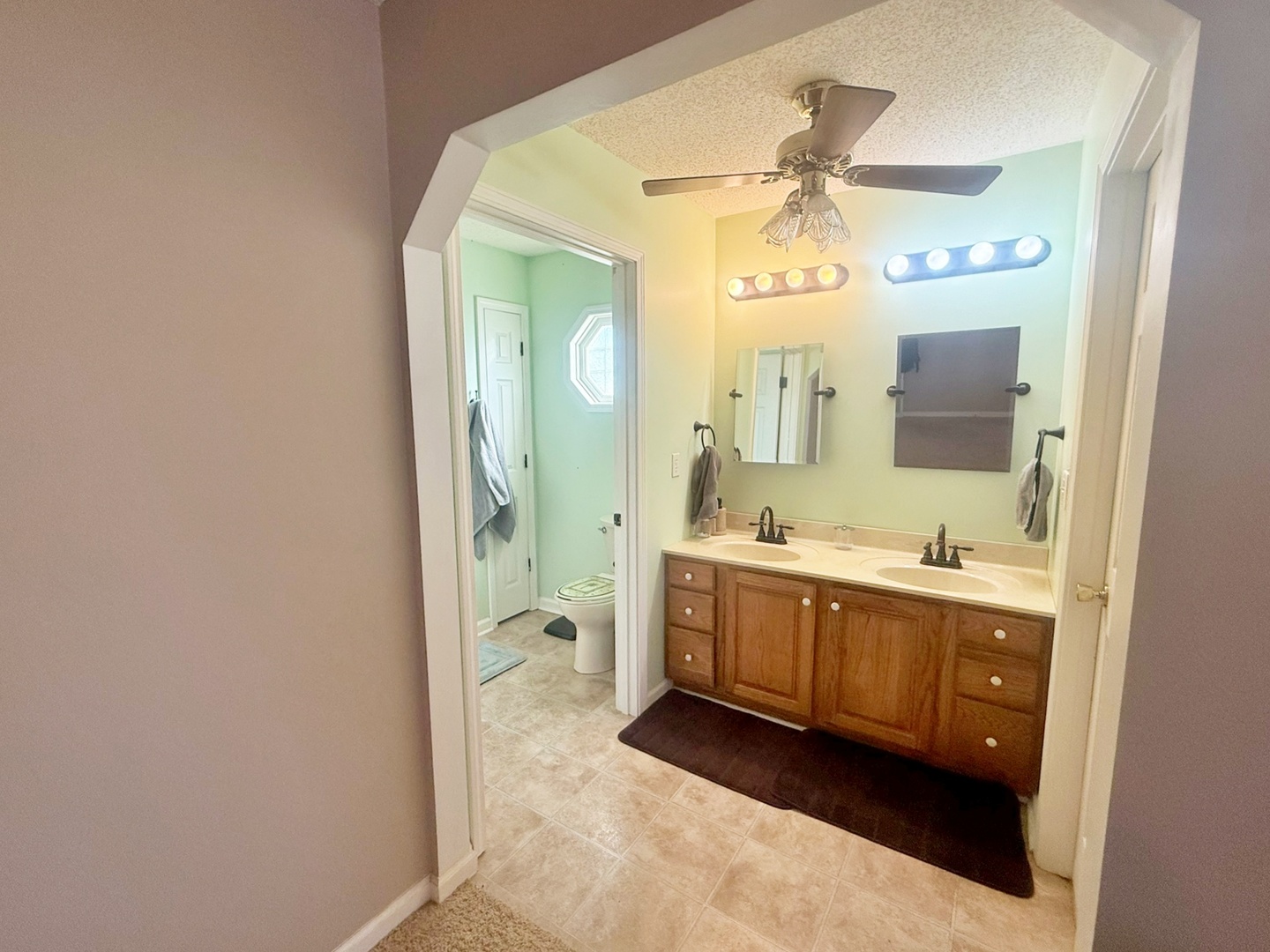 3675 Macedonia Road Metropolis, IL 62960 - Photo 49 of 50 a spacious bathroom with a double vanity sink a mirror and a bathtub