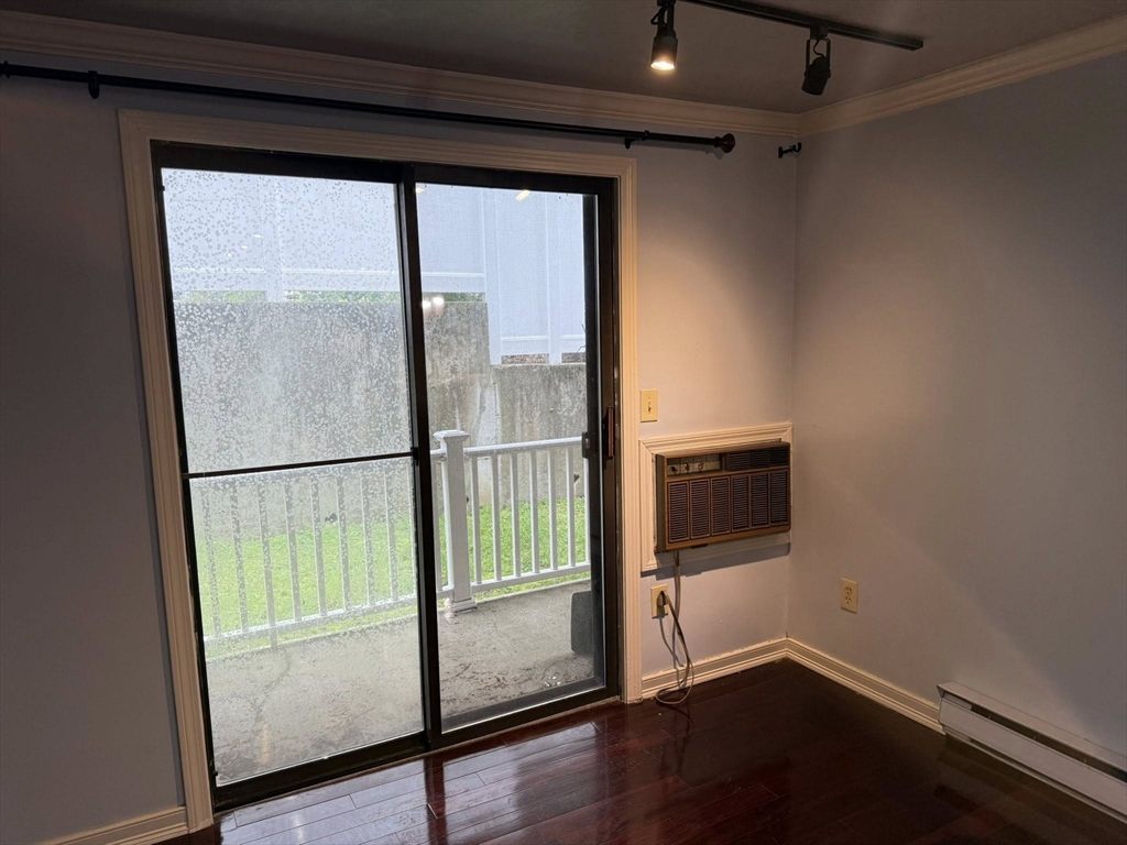 11 Hulbert Road, Unit 15 Worcester, MA 01603 - Photo 6 of 9 a view of empty room with wooden floor and fan