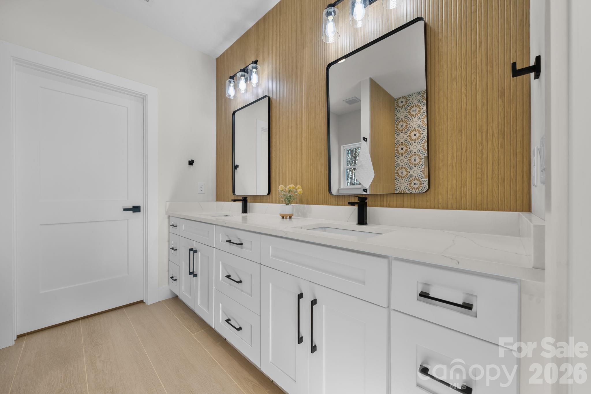 548 Car Farm Road Lincolnton, NC 28092 - Photo 14 of 41 a bathroom with double sink and a mirror