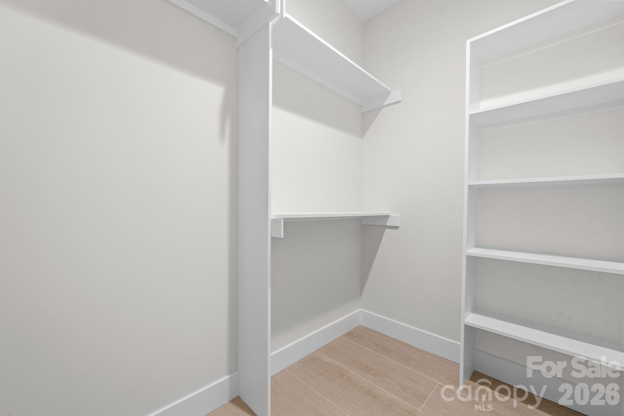 548 Car Farm Road Lincolnton, NC 28092 - Photo 18 of 41 a view of walk in closet with empty racks