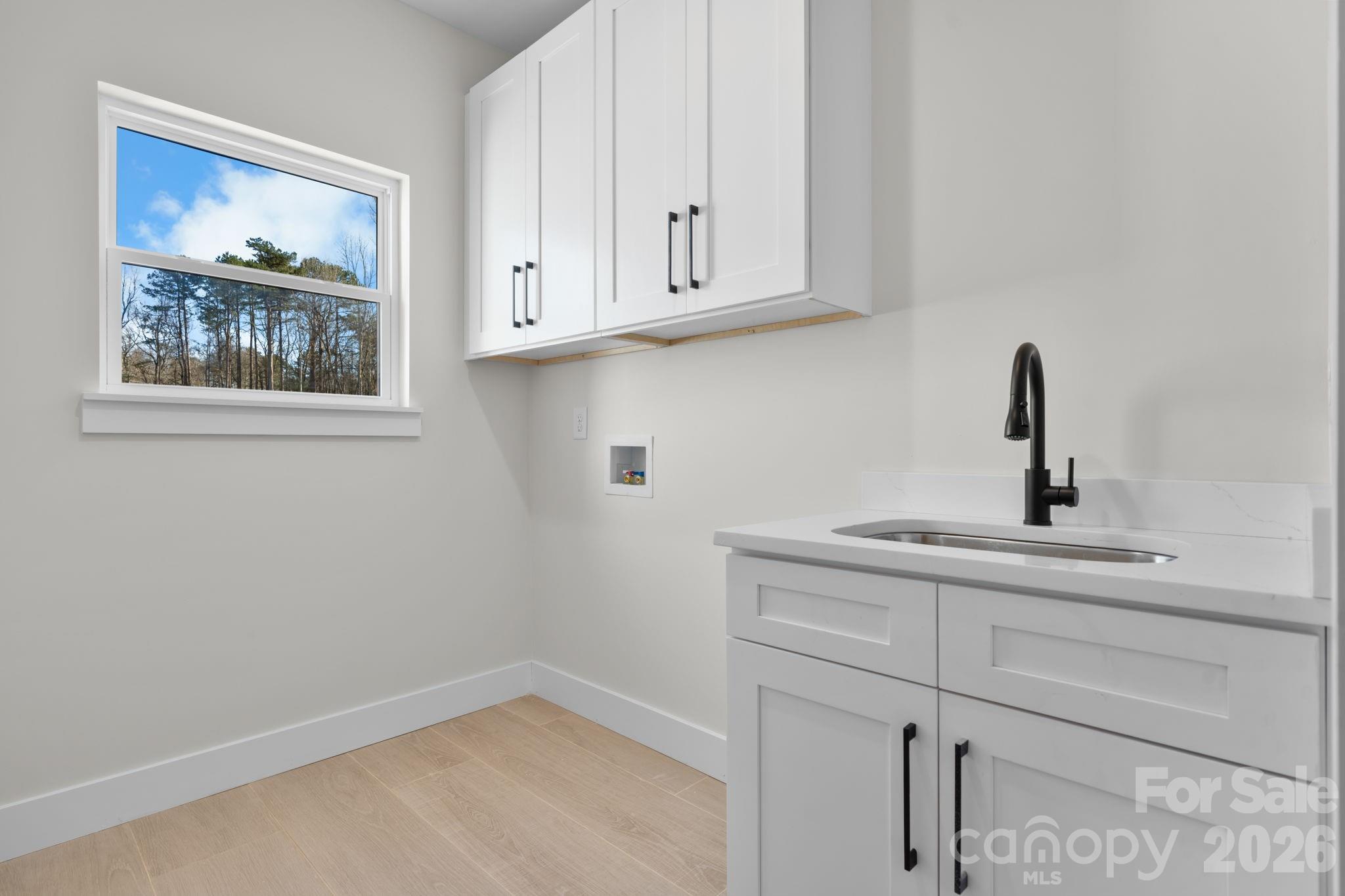 548 Car Farm Road Lincolnton, NC 28092 - Photo 22 of 41 a bathroom with a sink and cabinets