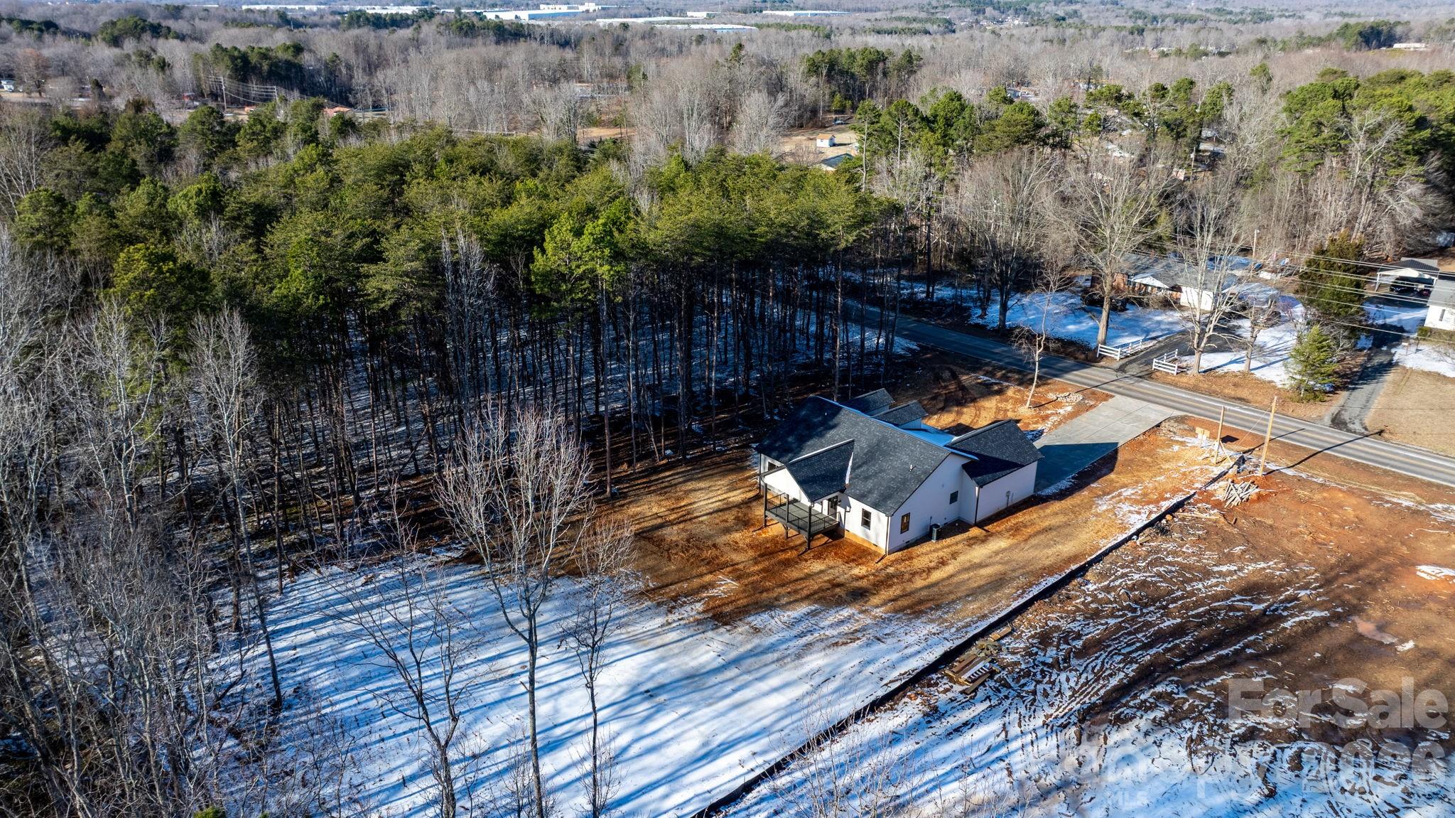548 Car Farm Road Lincolnton, NC 28092 - Photo 25 of 41 a view of a yard with table and chairs and wooden fence