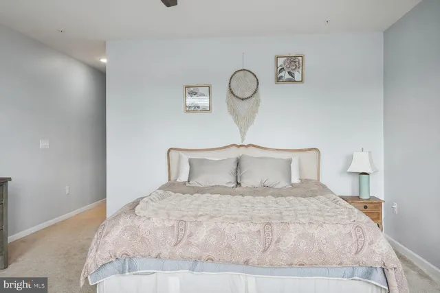 a large bed and a lamp