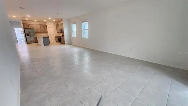a view of a room with a kitchen