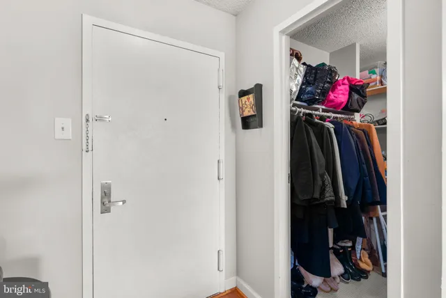 a view of a hallway with washer and dryer