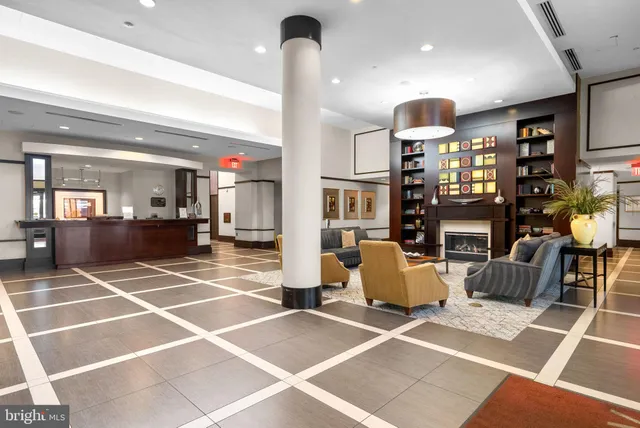 a room with gym equipment and a view of living room