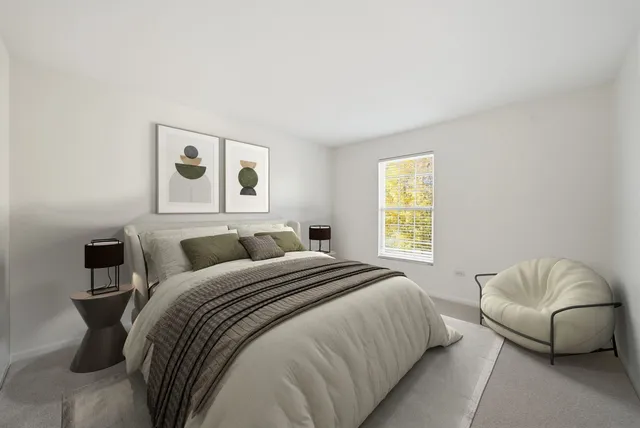 a bedroom with a bed and a couch