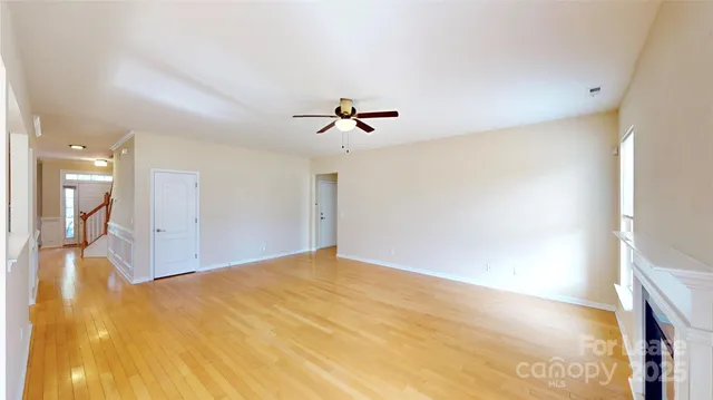 a view of a room with a ceiling fan