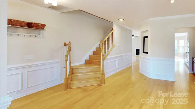 a view of an entryway with wooden floor