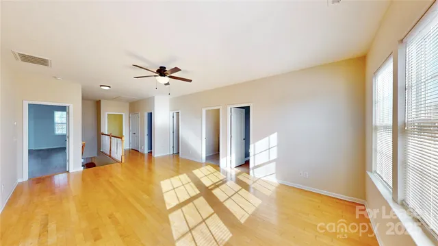 a bed room with a bed and a large window