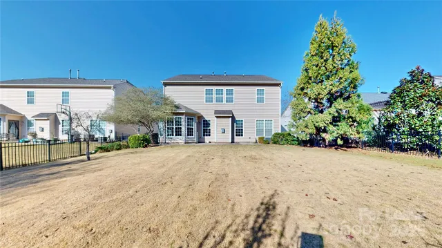 a view of a house with a yard and garage
