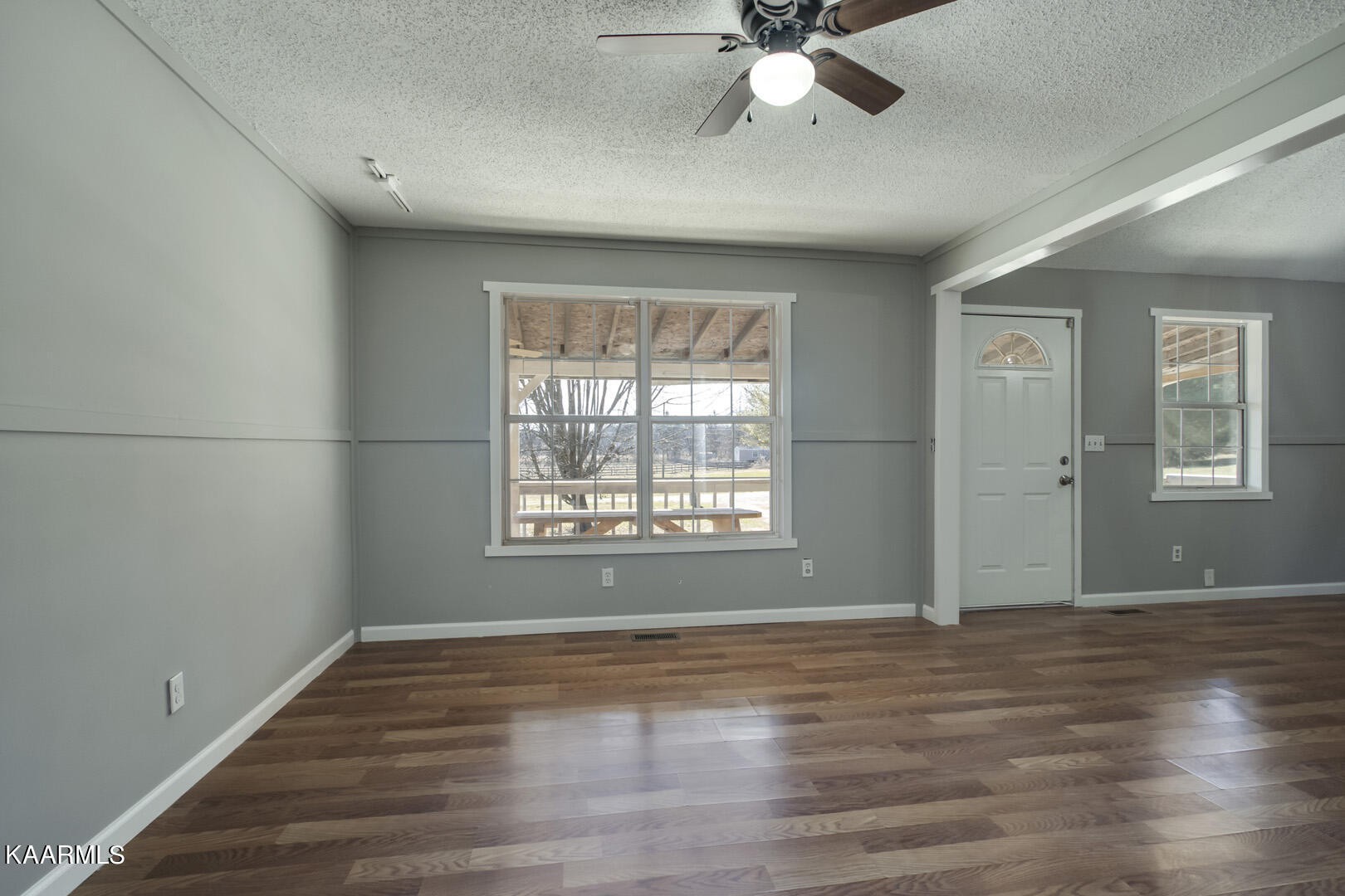 199 Honeysuckle Road Loudon, TN 37774 - Photo 14 of 33 a view of an empty room with wooden floor and a window