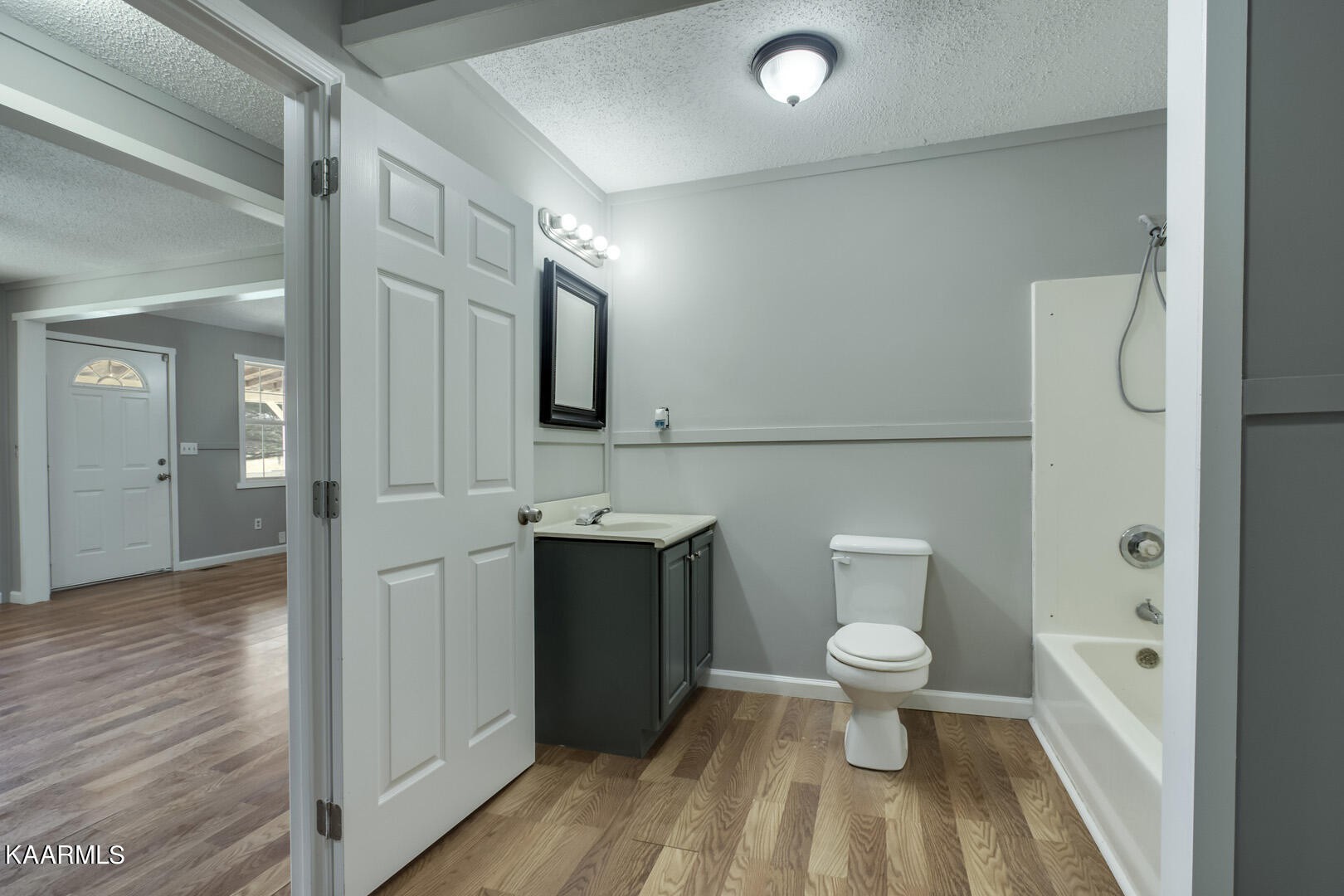199 Honeysuckle Road Loudon, TN 37774 - Photo 18 of 33 a bathroom with a sink a toilet and shower