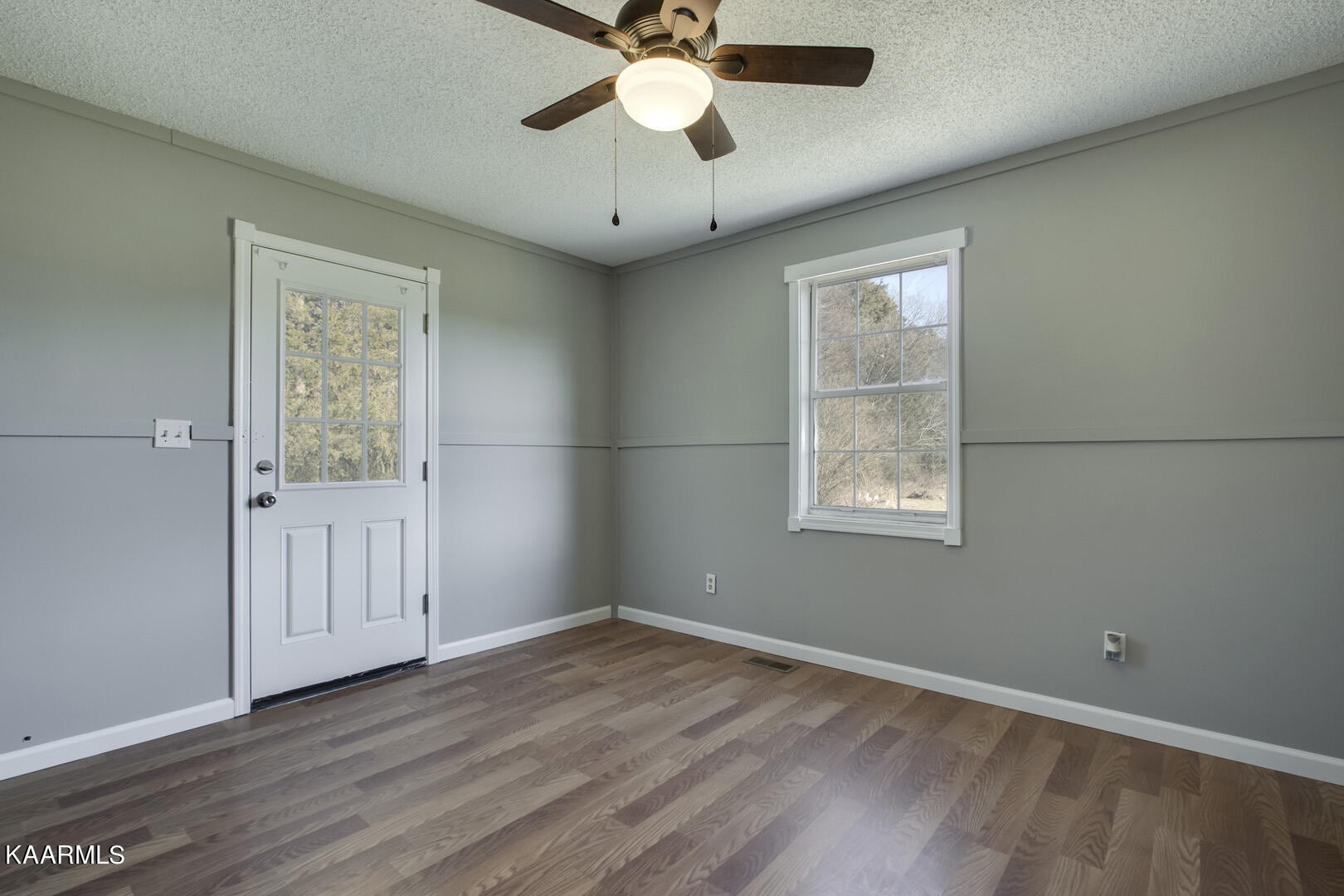 199 Honeysuckle Road Loudon, TN 37774 - Photo 20 of 33 wooden floor in an empty room with a window