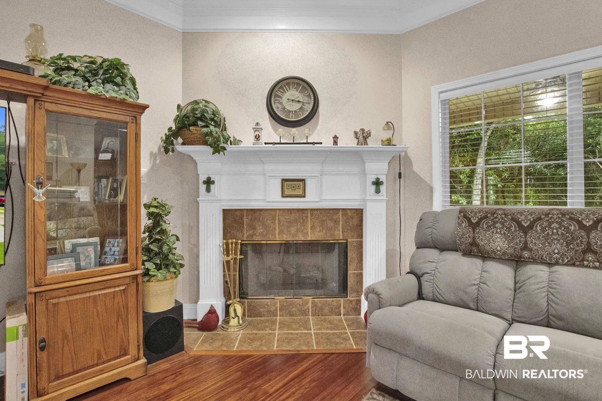1 Bens Bluff Daphne, AL 36527 - Photo 12 of 56 Living room with hardwood / wood-style floors, a tiled fireplace, and ornamental molding