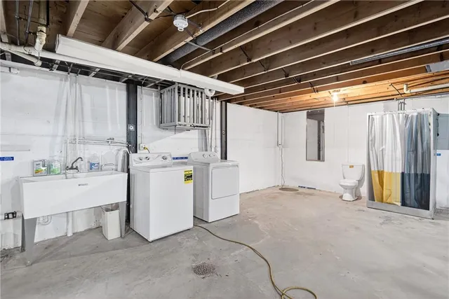 a view of storage and utility room with washer and dryer
