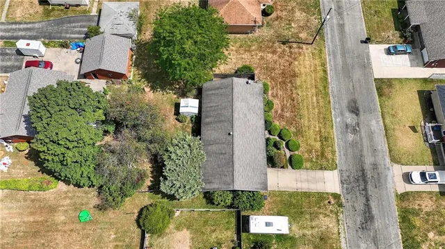 an aerial view of residential house with outdoor space and parking