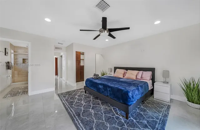 a bedroom with a bed and a dresser