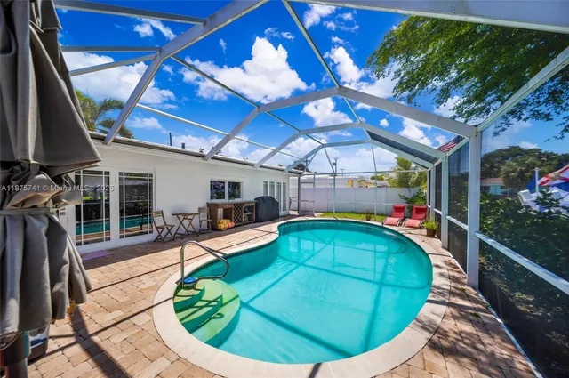 a view of a backyard with a patio and wooden floor