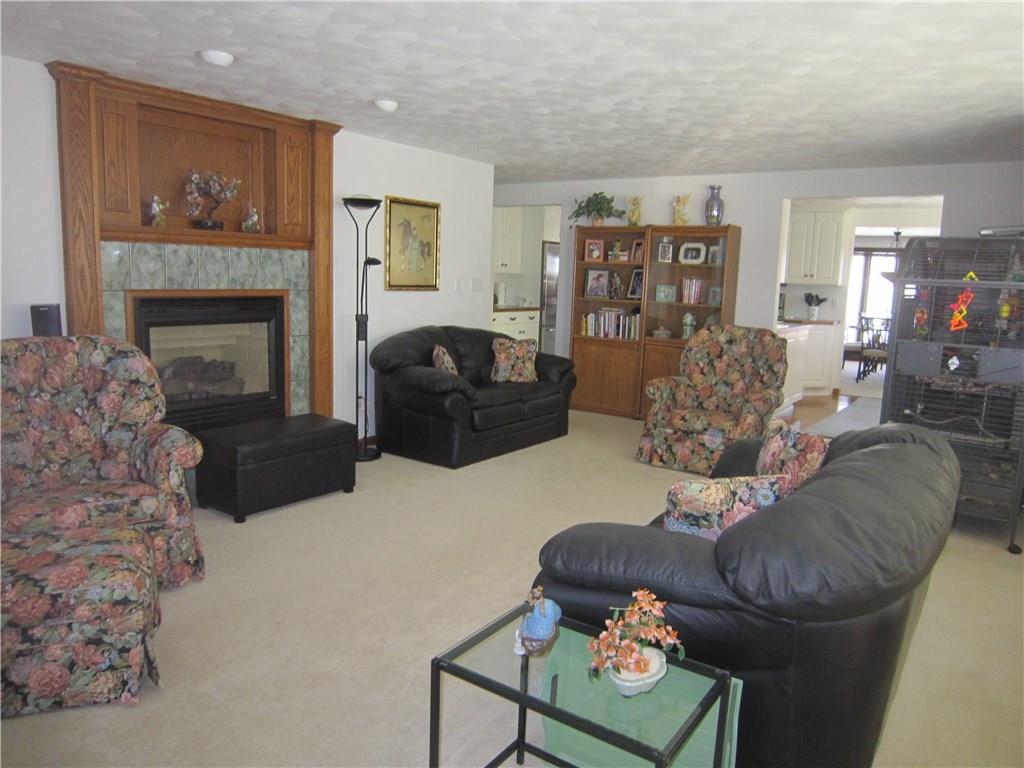 332 Lincoln Hall Road Elizabeth, PA 15037 - Photo 14 of 25 Family room features a gas fireplace with a lovely mantel, plenty of seating for all of your guests