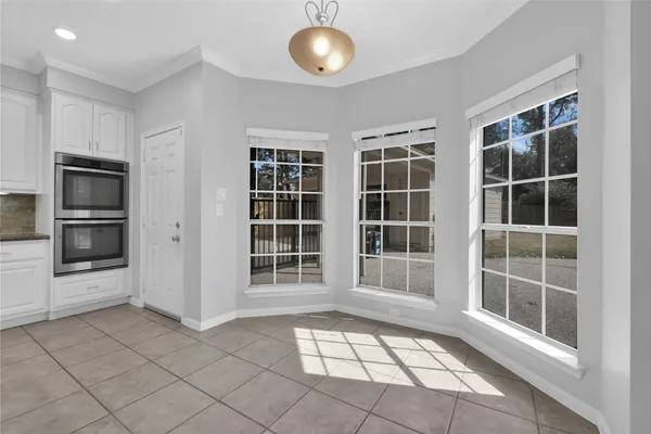 a kitchen with stainless steel appliances granite countertop a stove and a refrigerator