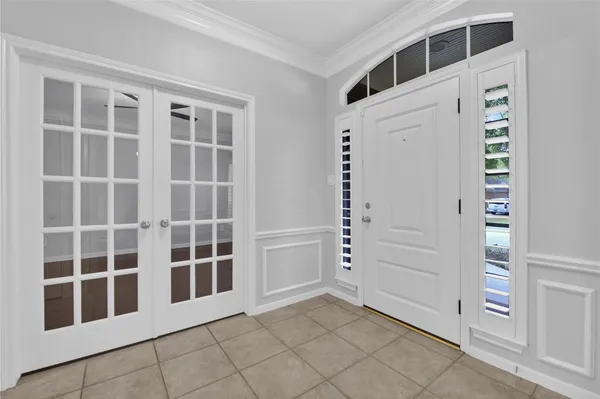 a view of an empty room with white walls