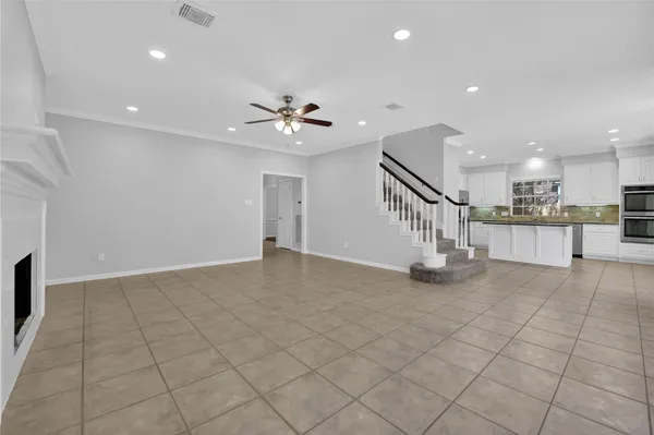 a view of empty room with windows