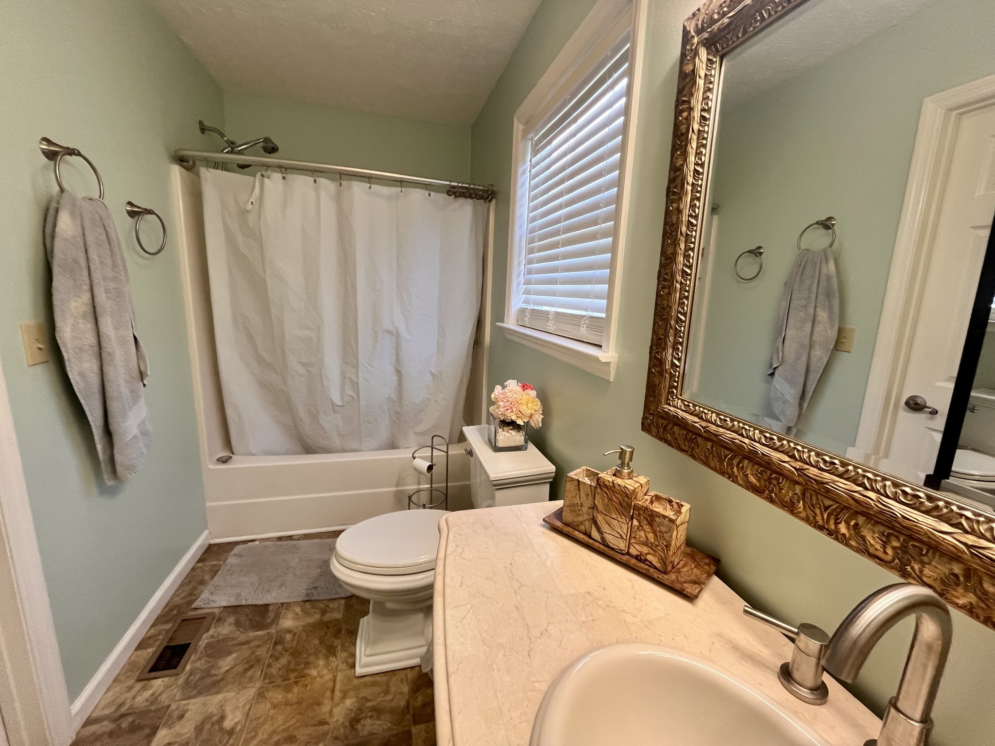 4038 Mt Zion Road Morrison, TN 37357 - Photo 11 of 38 a bathroom with a sink a toilet and a mirror