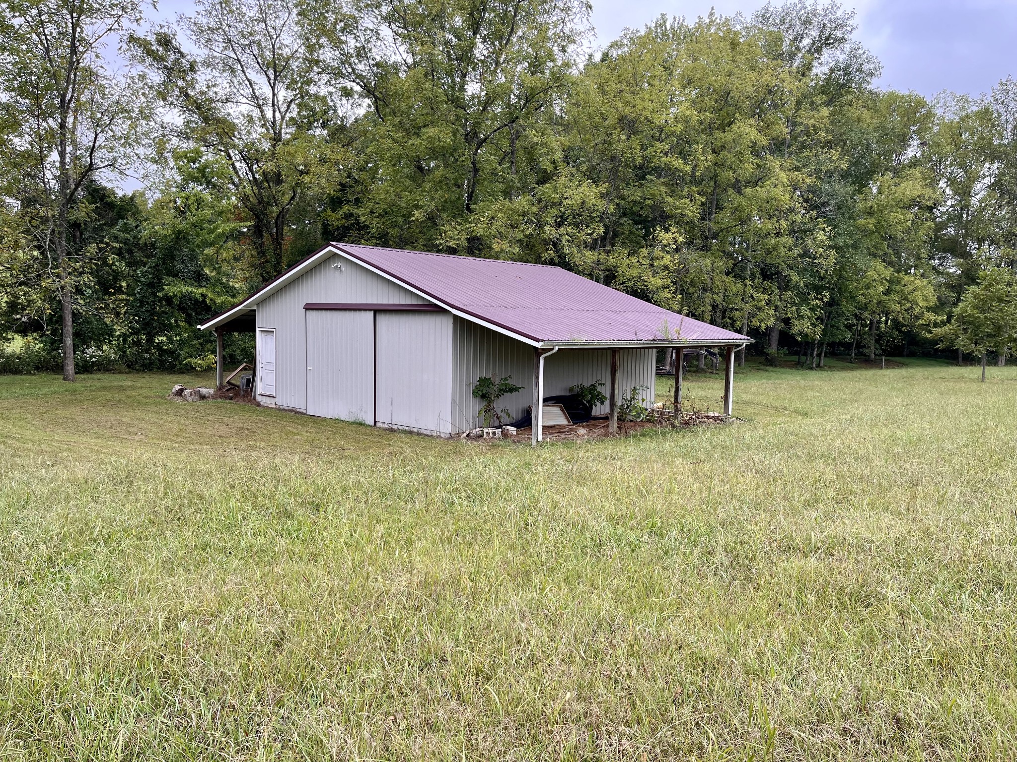 4038 Mt Zion Road Morrison, TN 37357 - Photo 25 of 38 a view of a house with a yard and large tree