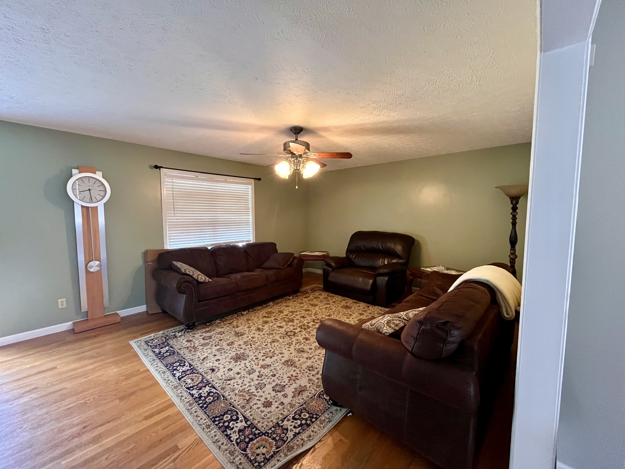 4038 Mt Zion Road Morrison, TN 37357 - Photo 4 of 38 a living room with furniture and a chandelier
