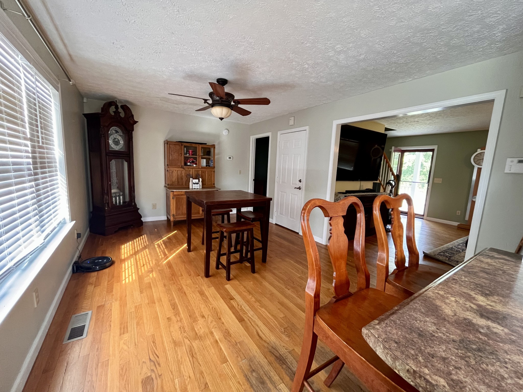 4038 Mt Zion Road Morrison, TN 37357 - Photo 5 of 38 a view of a dining room with furniture and wooden floor
