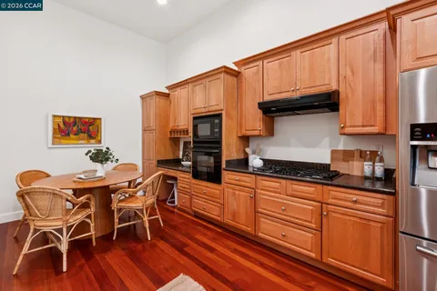 a kitchen with a refrigerator and a sink