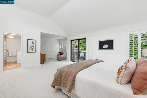 a bedroom with furniture and windows
