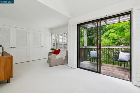 a bedroom with furniture and window