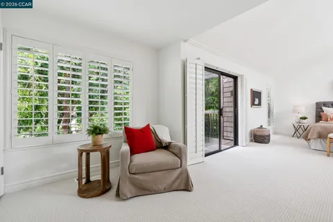 a view of balcony with wooden floor and bench