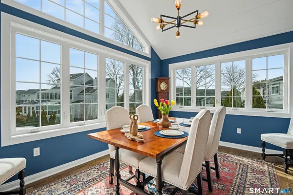 a view of a dining room with furniture window and outside view