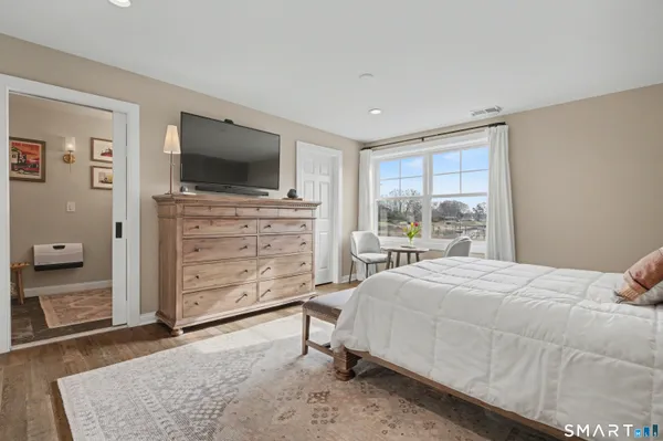 a bedroom with a bed and furniture