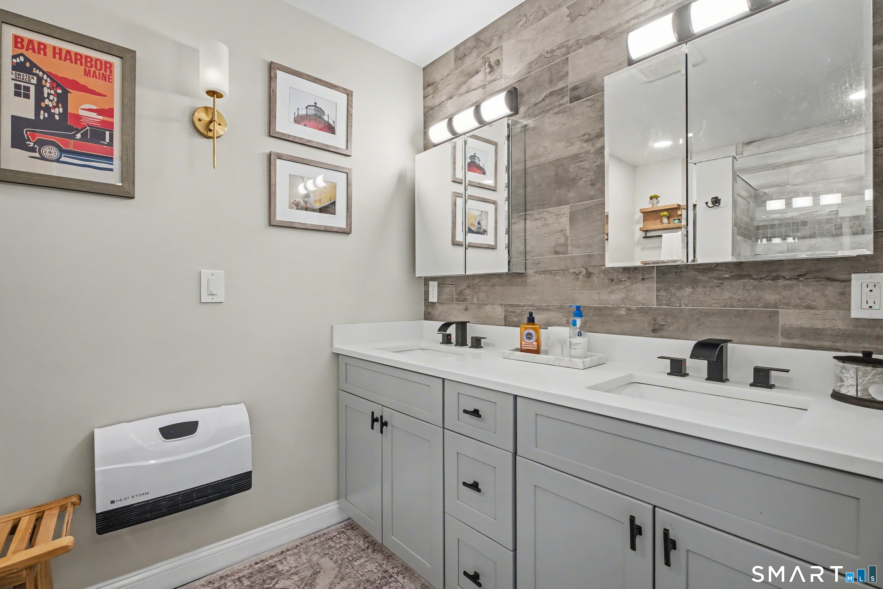 25 Harbor Street Branford, CT 06405 - Photo 17 of 34 a bathroom with a sink and a mirror