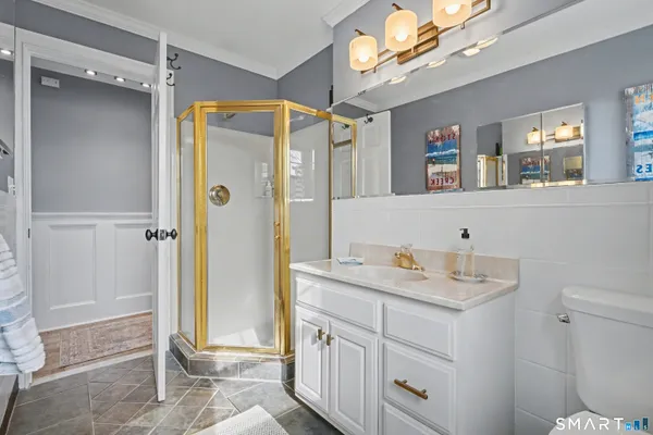a spacious bathroom with a sink a mirror and a shower