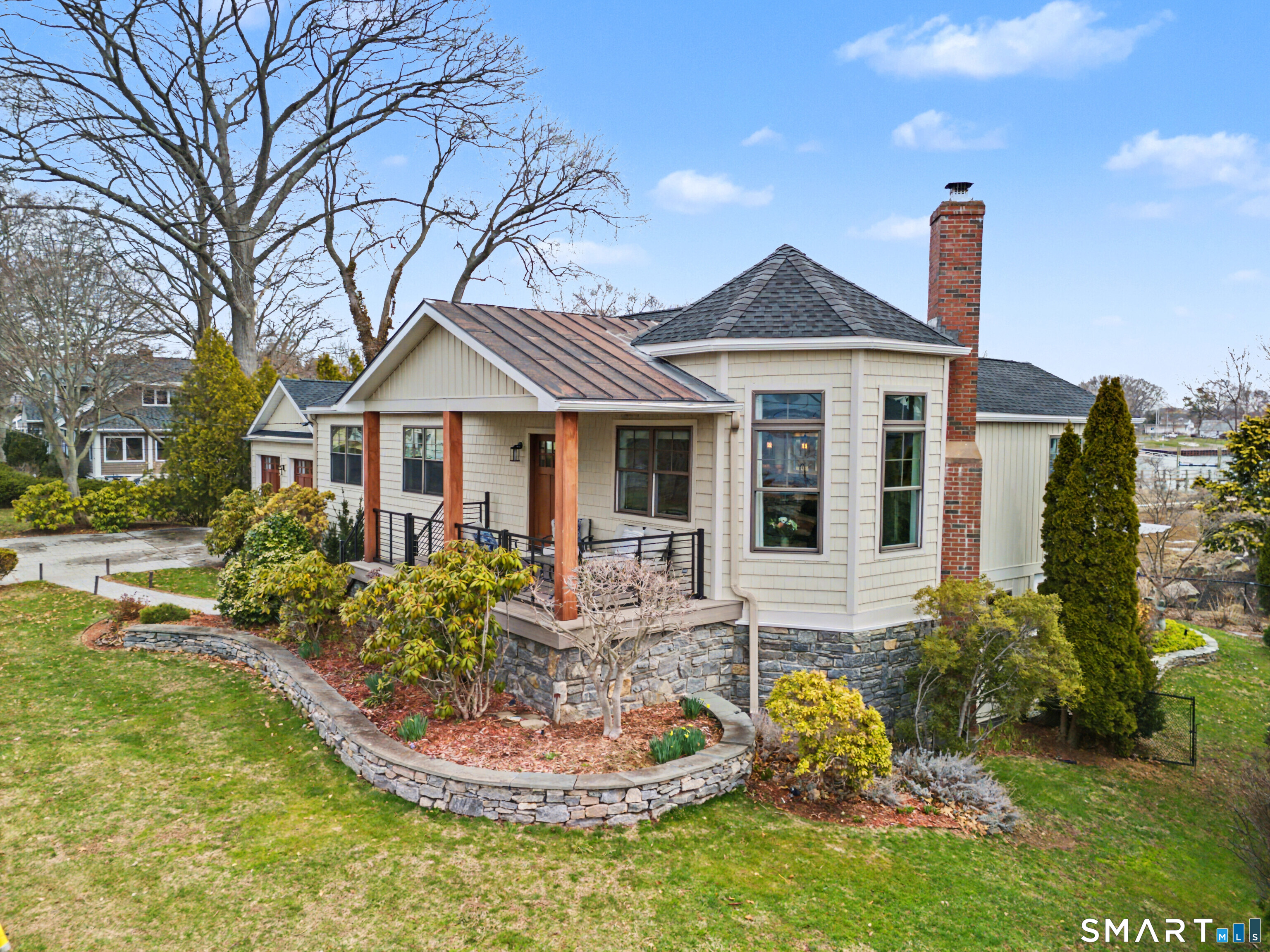 25 Harbor Street Branford, CT 06405 - Photo 2 of 34 a front view of a house with a yard table and chairs