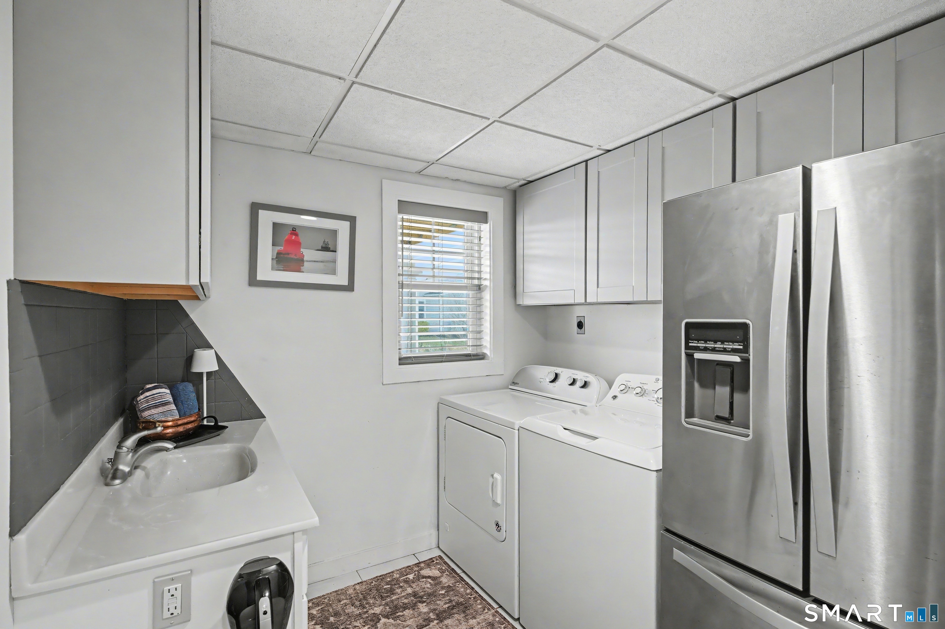 25 Harbor Street Branford, CT 06405 - Photo 26 of 34 a utility room with closet dryer and washer