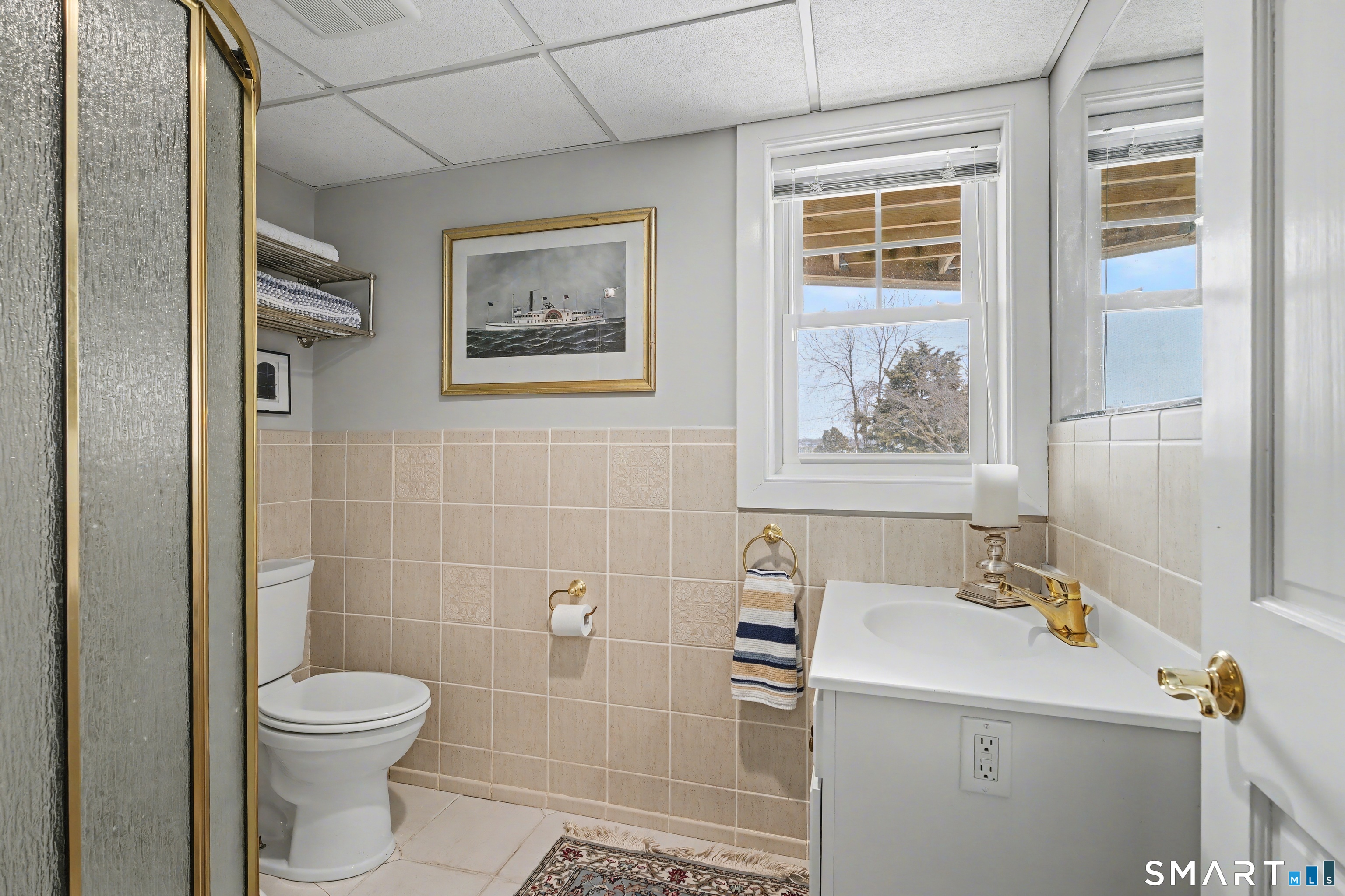 25 Harbor Street Branford, CT 06405 - Photo 27 of 34 a bathroom with a toilet sink and mirror