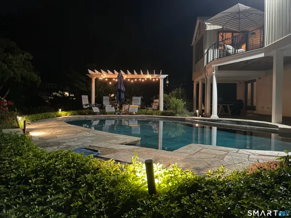 a view of swimming pool with a yard