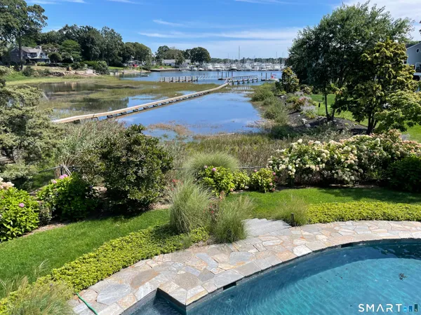 a view of a lake with a yard and lake view
