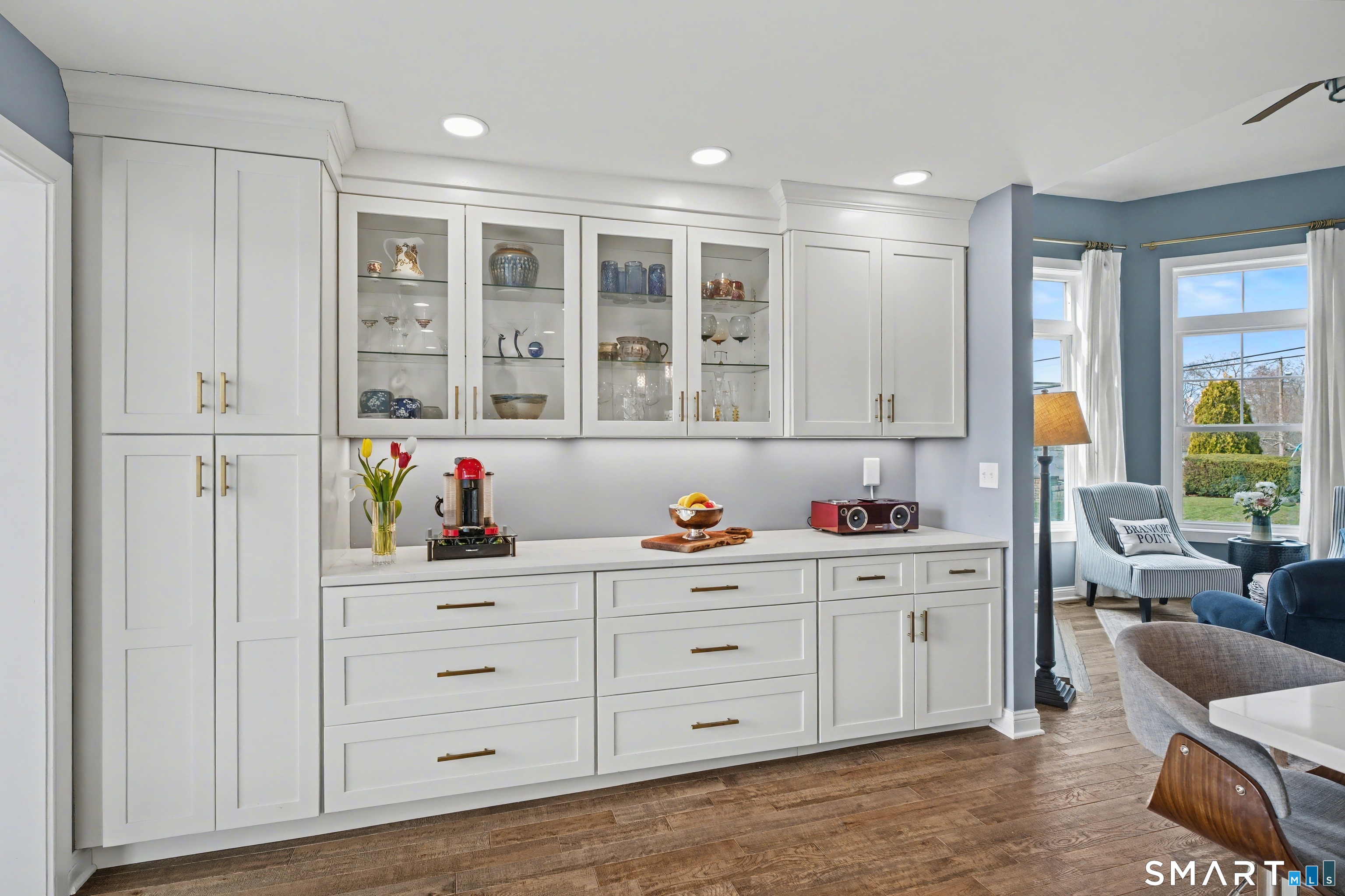 25 Harbor Street Branford, CT 06405 - Photo 9 of 34 a kitchen with white cabinets and window