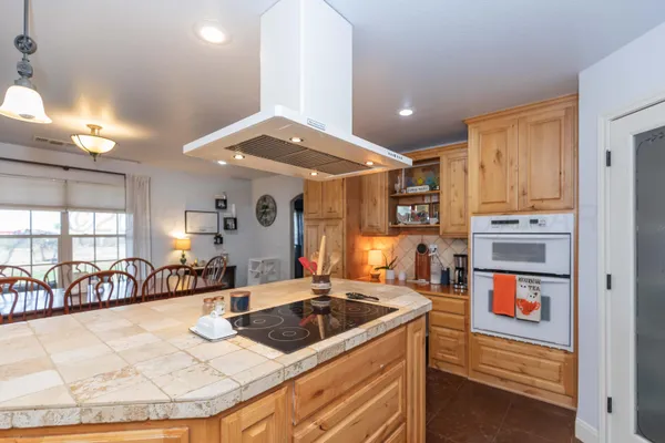 a kitchen with stainless steel appliances granite countertop a stove and a sink